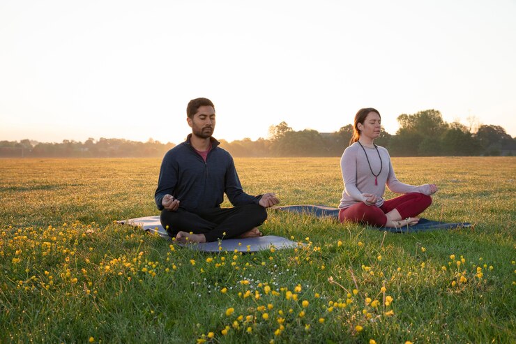 man woman doing yoga together outdoors 23 2148988353